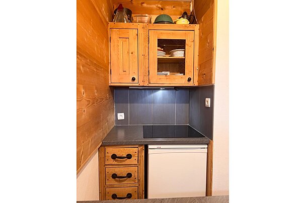 A bosch dishwasher sits under a sink in a kitchen