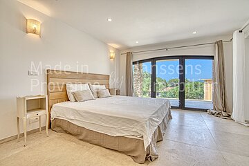 A bedroom with the words made in provence on the wall