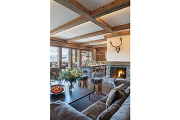 A living room with a fireplace and a couch