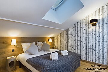 A bathroom with a bathtub a sink and a toilet