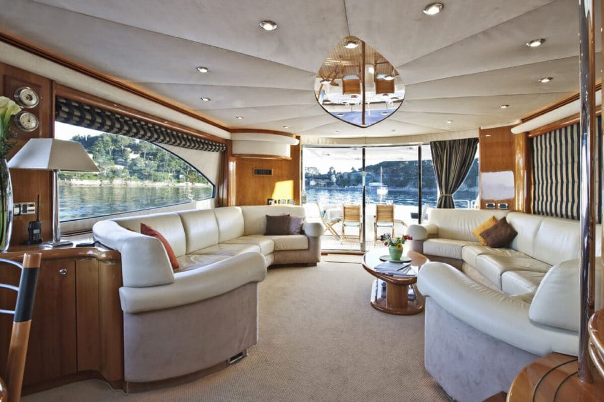 A living room on a boat with a couch and a table