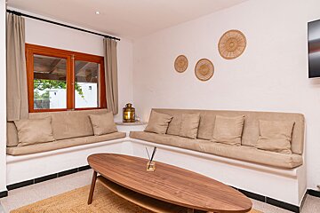 A living room with a couch and a coffee table