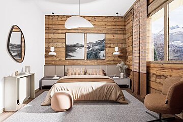 Cozy, modern cabin bedroom featuring warm wooden walls, neutral-toned bedding, abstract pendant lighting, and a window with a mountain view.