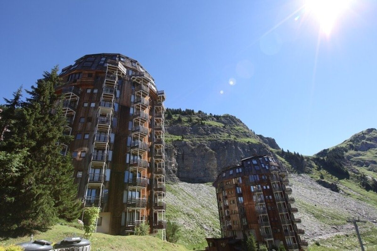 A tall building with stairs leading up to the top of it