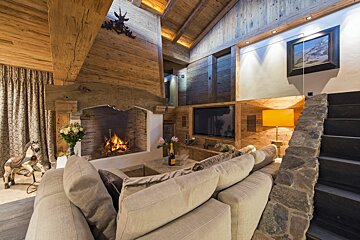 A living room with a fireplace and a couch