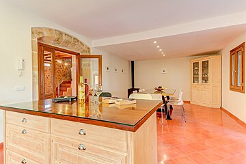 A bottle of wine sits on a counter in a living room