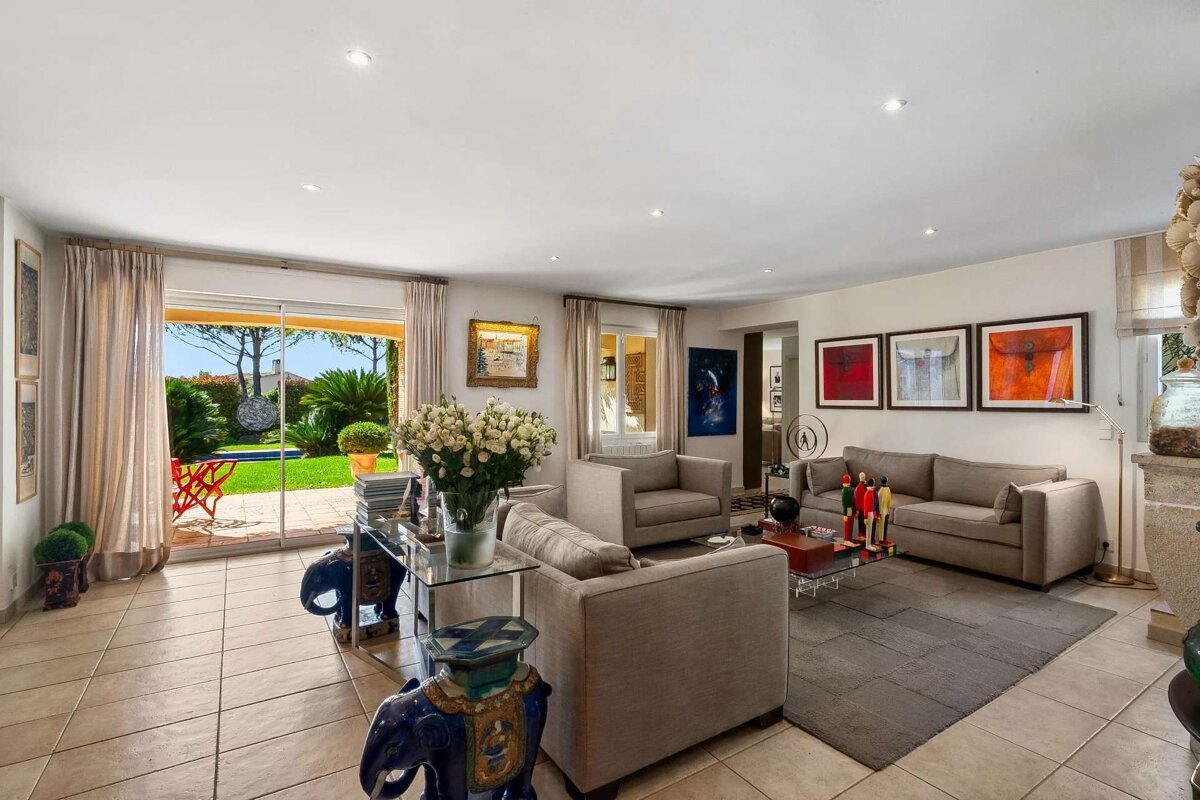 A living room with a sliding glass door leading to a patio