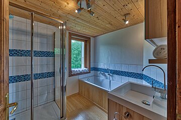 A bathroom with a bathtub and a sink