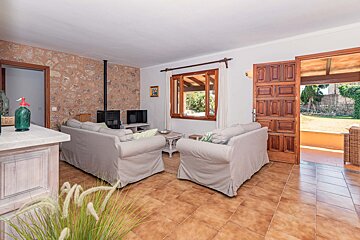 A living room with a couch and two chairs