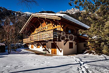 A photo of a snowy cabin with the word photo on it