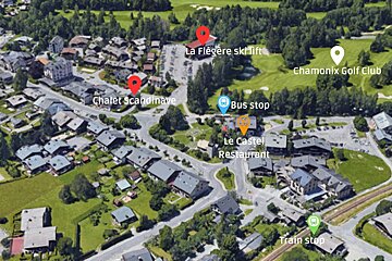 An aerial view of a residential area with chalet scandinave in the middle