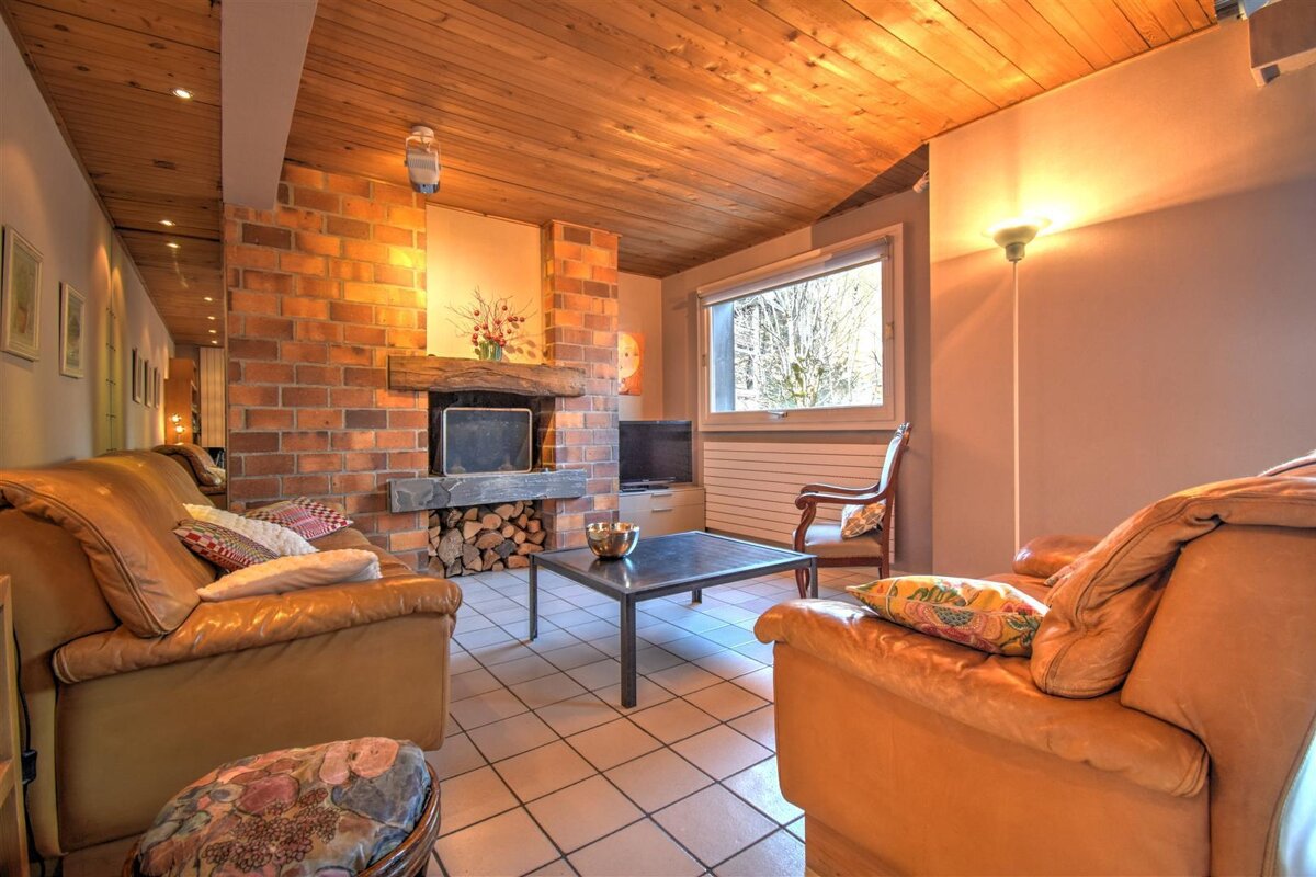 A living room with a fireplace and a couch