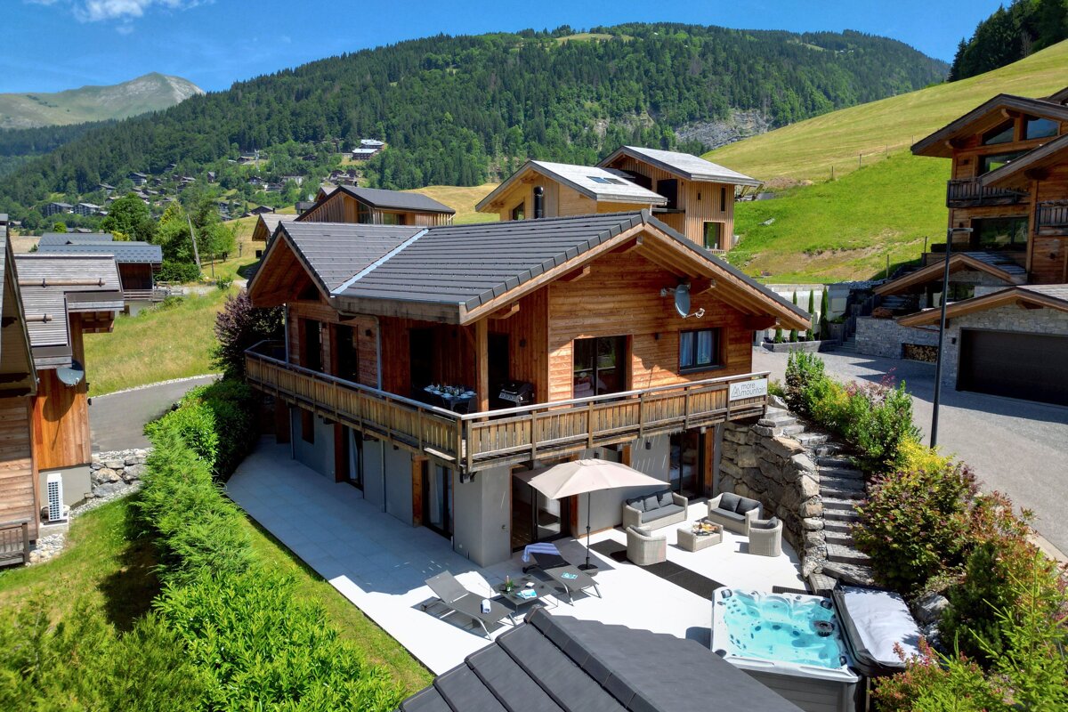 A large house with a hot tub in front of it