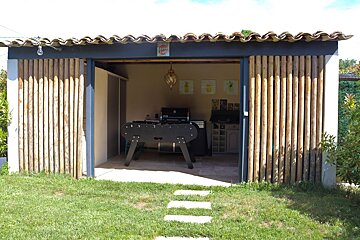 A shed with a sign on the roof that says coca cola