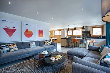 A living room with a couch and two coffee tables