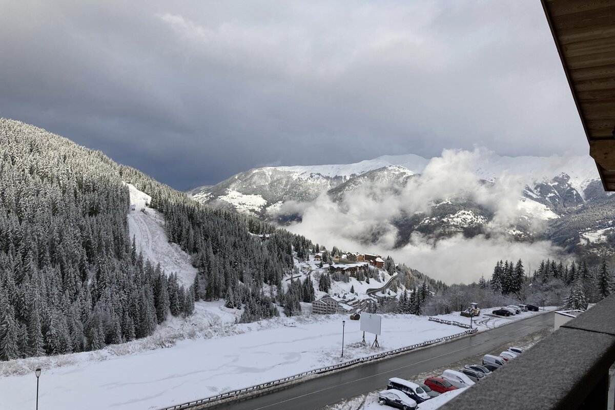 A bathroom with a toilet and a rental designer logo