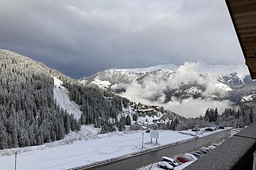 A bathroom with a toilet and a rental designer logo