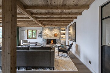A living room with a fireplace and a couch