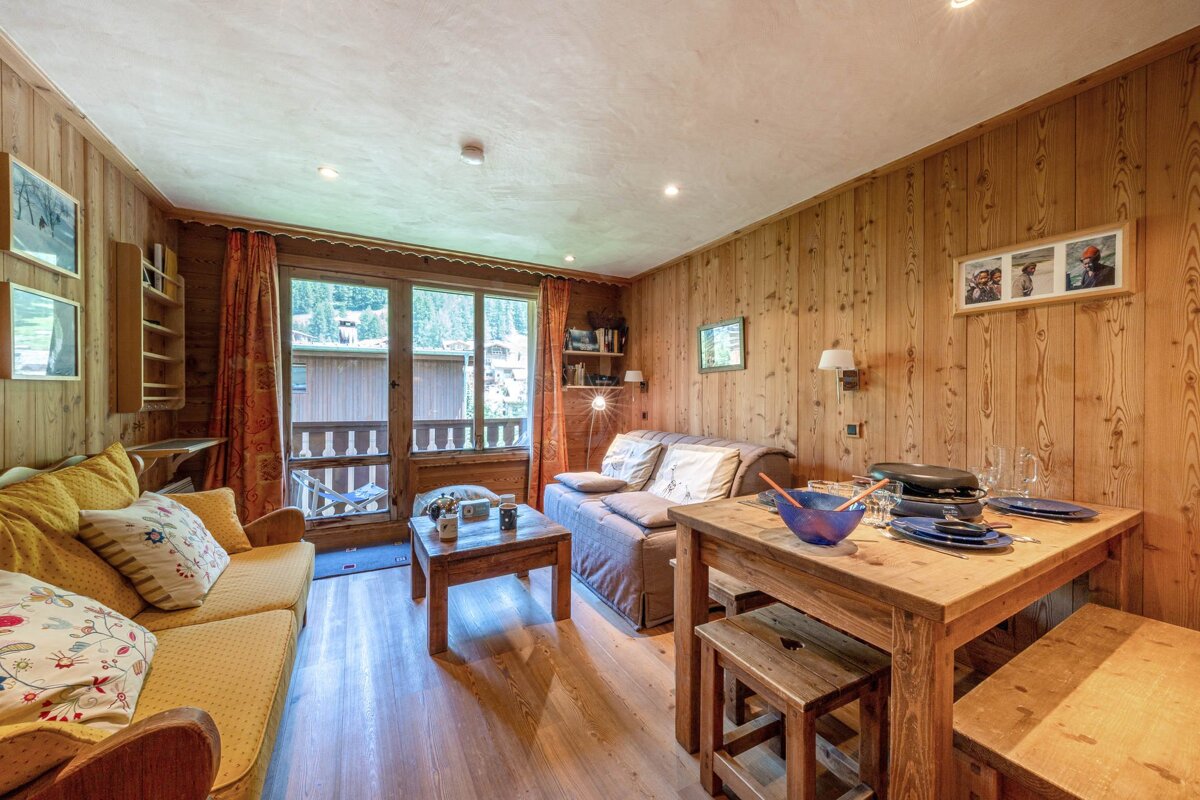A living room with a couch and a table with plates on it