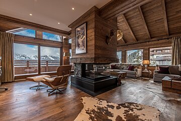 A living room with a fireplace and a picture on the wall that says ' montana '