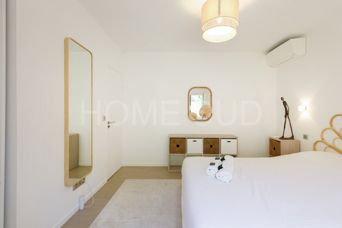 A bedroom with the word home on the wall