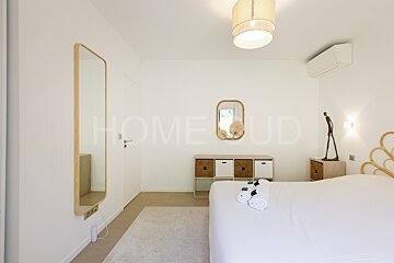 A bedroom with the word home on the wall