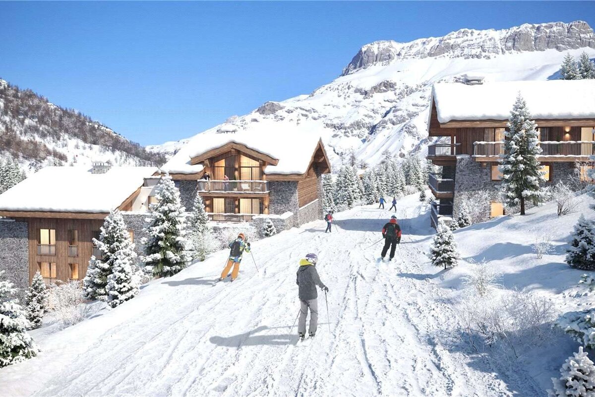 A group of people skiing down a snow covered path