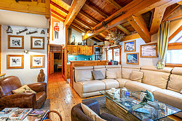 A living room with a couch a chair and a coffee table