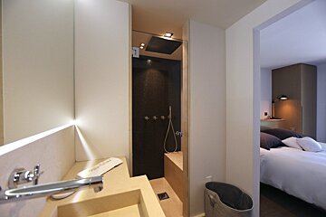 A bathroom with a sink and a towel that says 