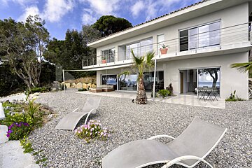 A large white house with a lot of windows