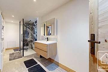 A bathroom with the word alpine on the door