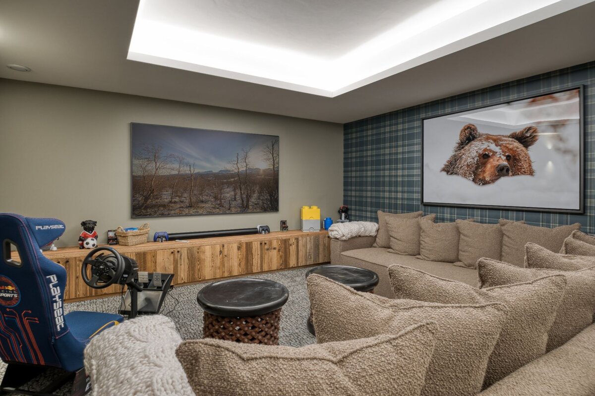 A playseat in a room with a picture of a bear on the wall