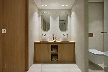 A bathroom with two sinks and two mirrors