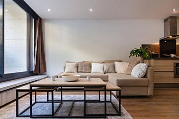 A living room with a couch and a coffee table