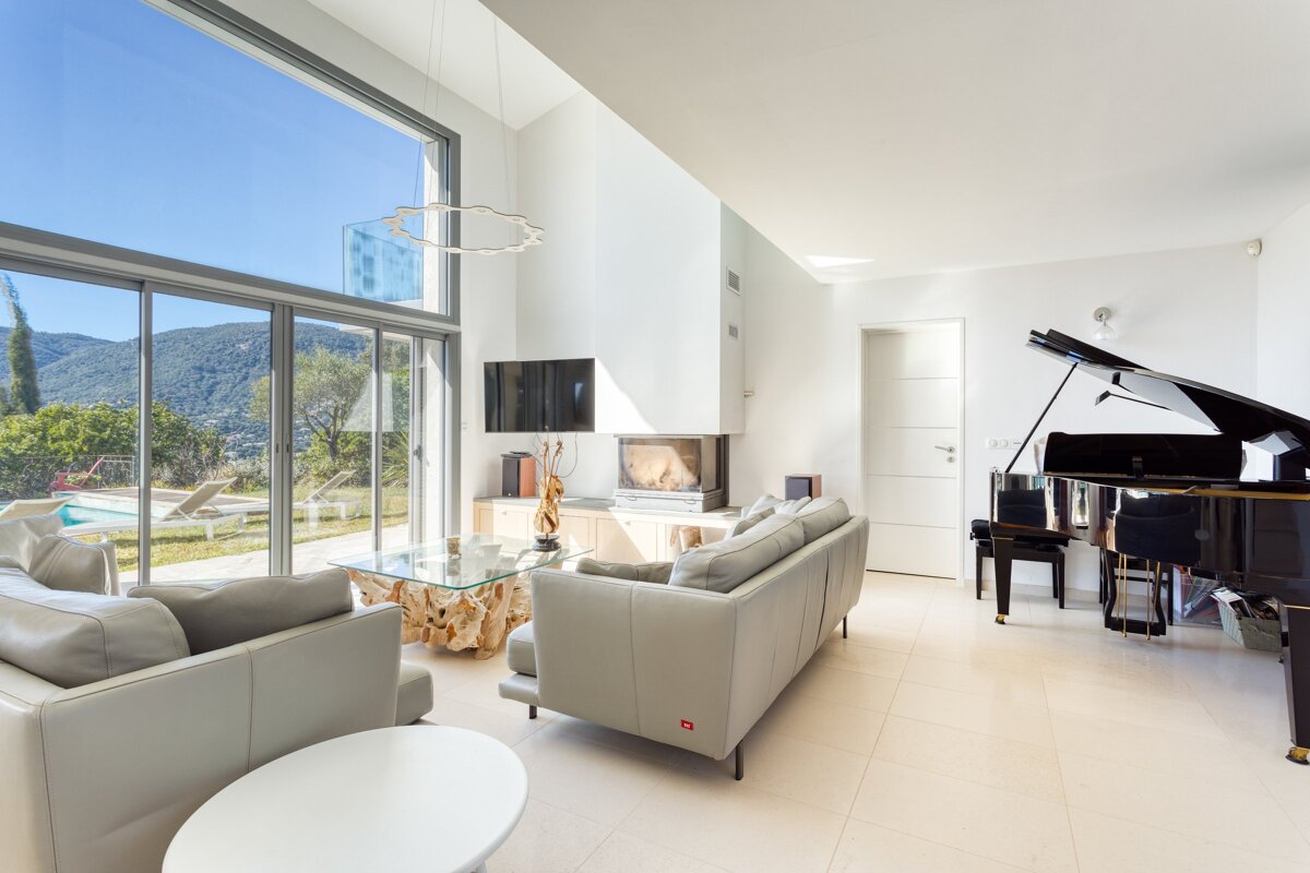 A living room with a piano and a couch