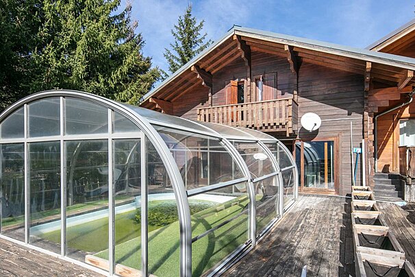 A large house with a satellite dish on the side of it