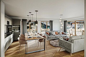 Modern open-plan kitchen, dining, and living room with large windows overlooking a snowy landscape, featuring wood floors and grey furniture.