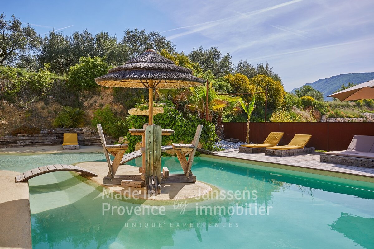 A swimming pool with the words made in provence by immobilier on the bottom