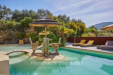 A swimming pool with the words made in provence by immobilier on the bottom