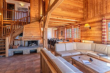 A living room with a couch and a fireplace