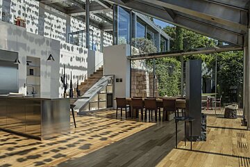 A kitchen and dining room in a modern house