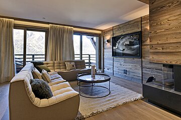 A living room with a couch and a table