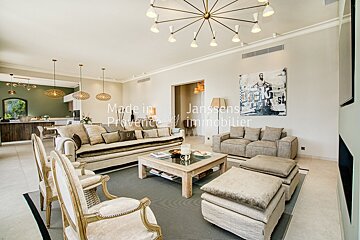 A living room with a couch and chairs and the words made in provence on the wall