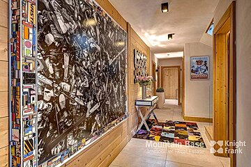 A hallway with a poster on the wall that says chamonix