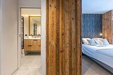 A snowy building with a fence in front of it