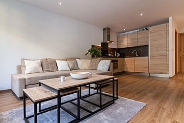 A living room with a couch and a coffee table
