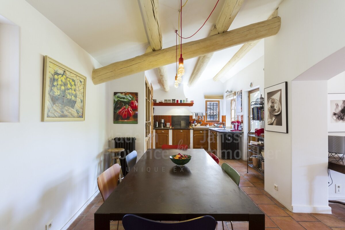 A dining room with a table and chairs and a sign that says unique experience