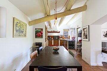 A dining room with a table and chairs and a sign that says unique experience