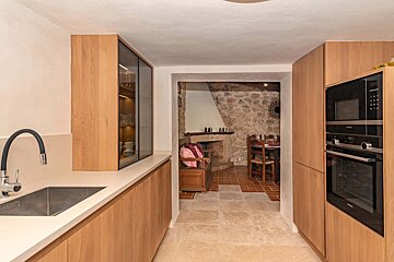 A kitchen with wooden cabinets and a siemens oven