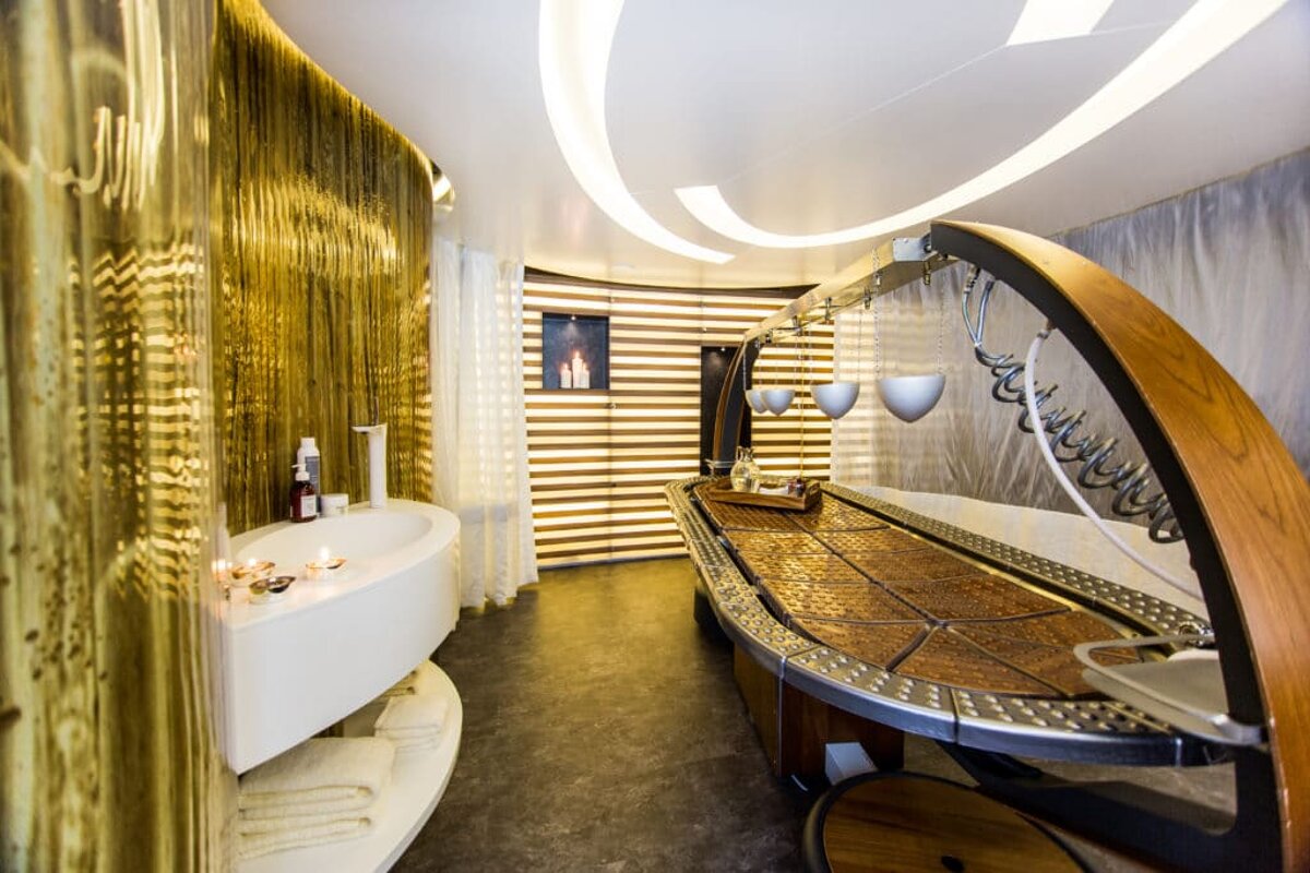 A bathroom with a wooden table and a bathtub